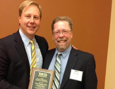 C-N team physician Matt Rappe (left) and Director of Sports Medicine Mike Van Bruggen following the ceremony where Rappe was presented his Tenn. Sports Medicine Person of the Year honor.