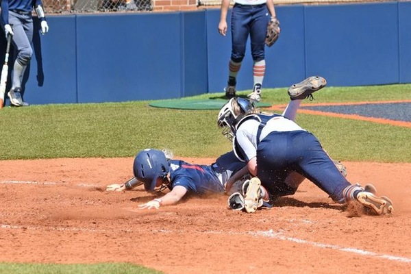 KaraLynne Levi tags out Kaylee Cook at the plate