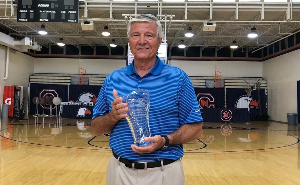 Carl Torbush poses with his Tennessee Sports Hall of Fame cup