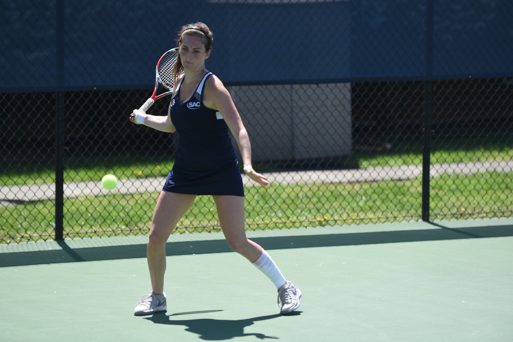 Queens overpowers Eagles in singles play