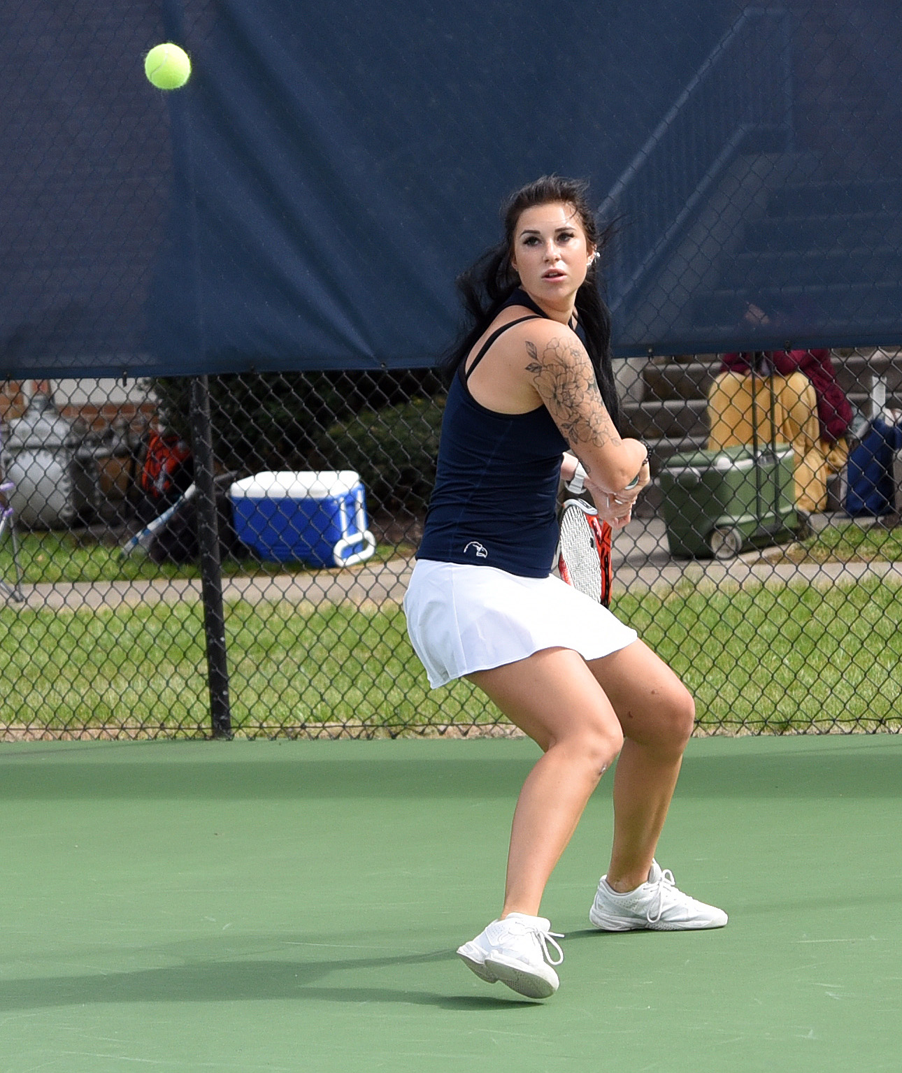 Rainy Sunday moves tennis match inside, but Eagles come out on top